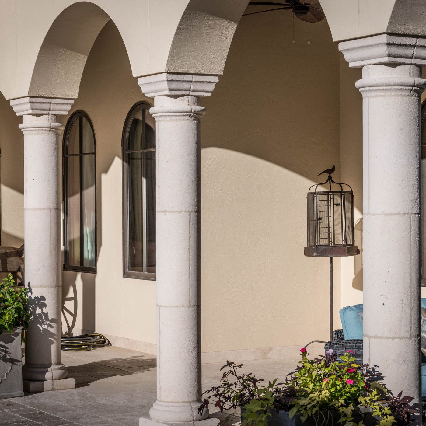 three white pillars on a home patio area