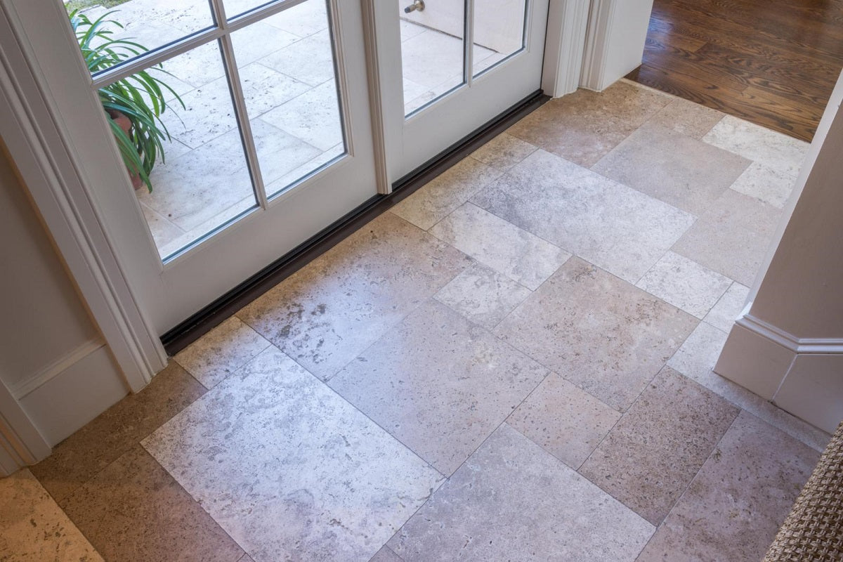 A travertine tile floor.