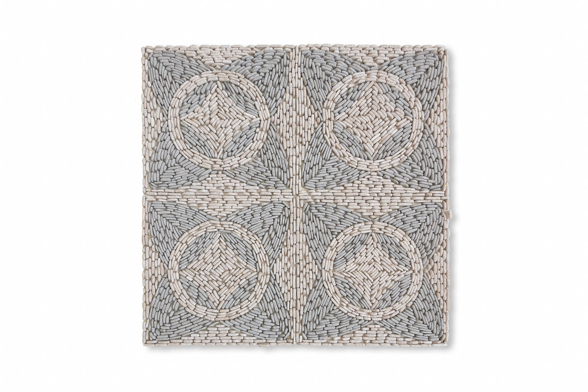 Bussola Pebble shown in Charcoal Limestone and Pearl Marble.