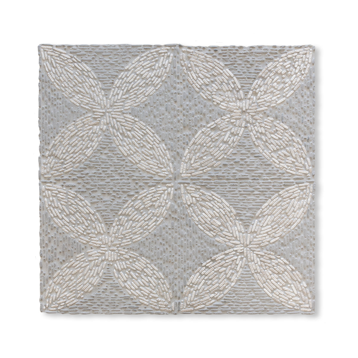 Petals Pebble shown in Pearl Marble and Charcoal Limestone.