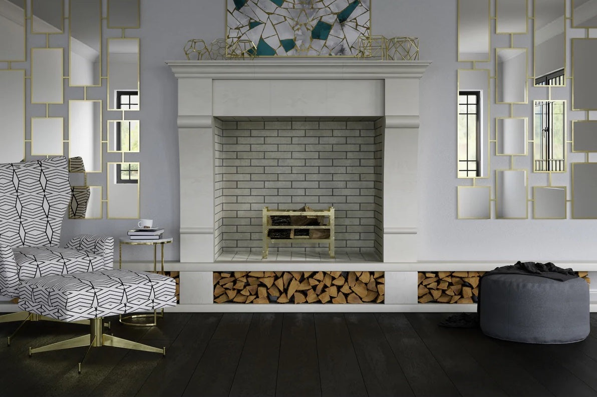 Modern white fireplace with gray brick interior, brass log holder, and built-in firewood storage below