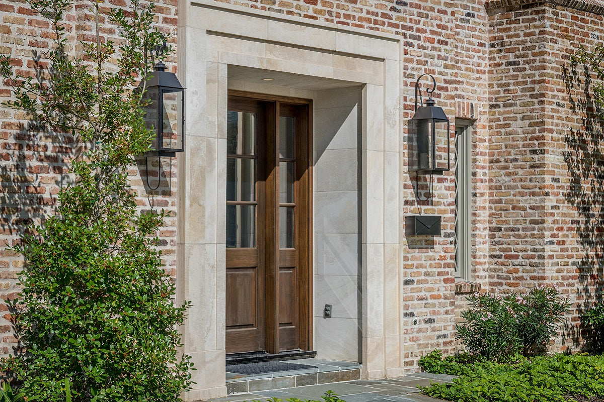 brick house front door with a white marble frame