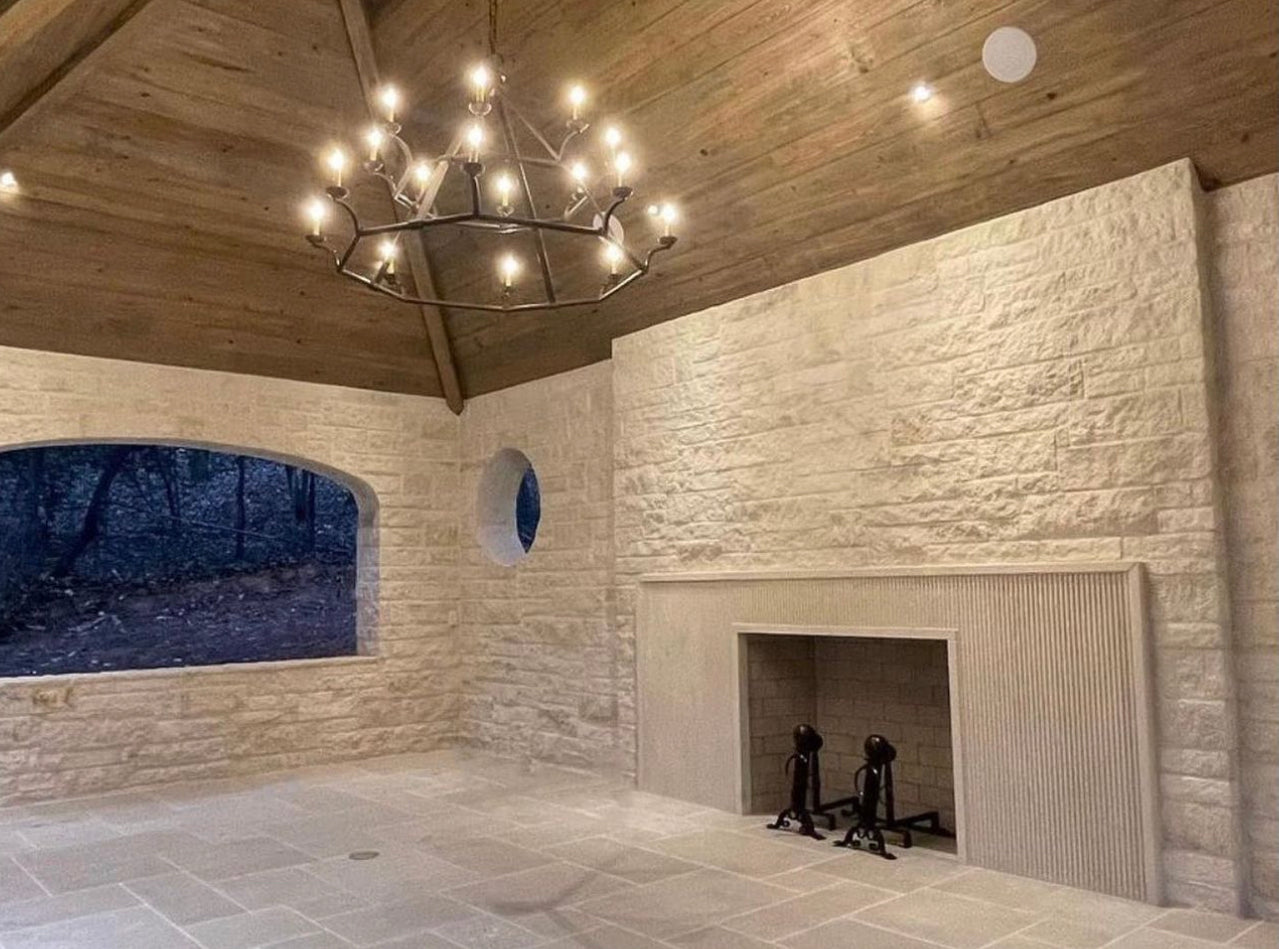 natural white stone walls with a fireplace