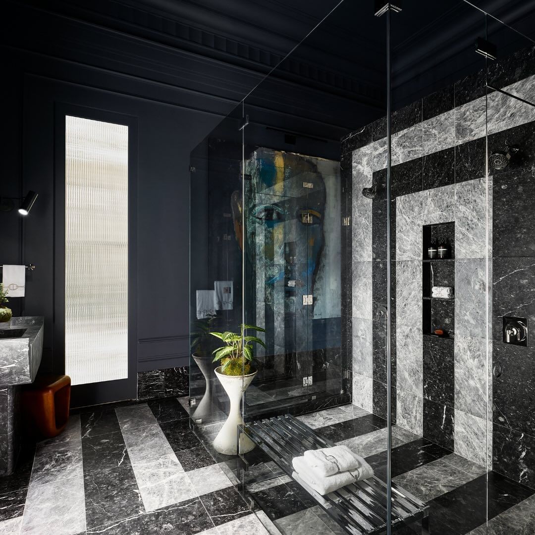 a black and white tiled bathroom shower floor