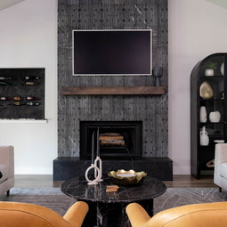 Koi tile fireplace shown in Nero Marble